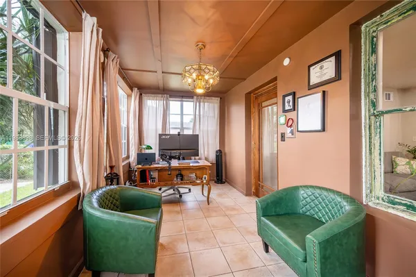 a living room filled with furniture and a window