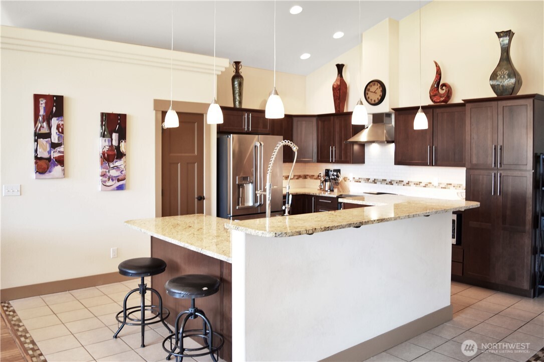 1024 Columbia Point Entiat, WA 98822 - Photo 14 of 22 a large kitchen with stainless steel appliances granite countertop a sink and a refrigerator