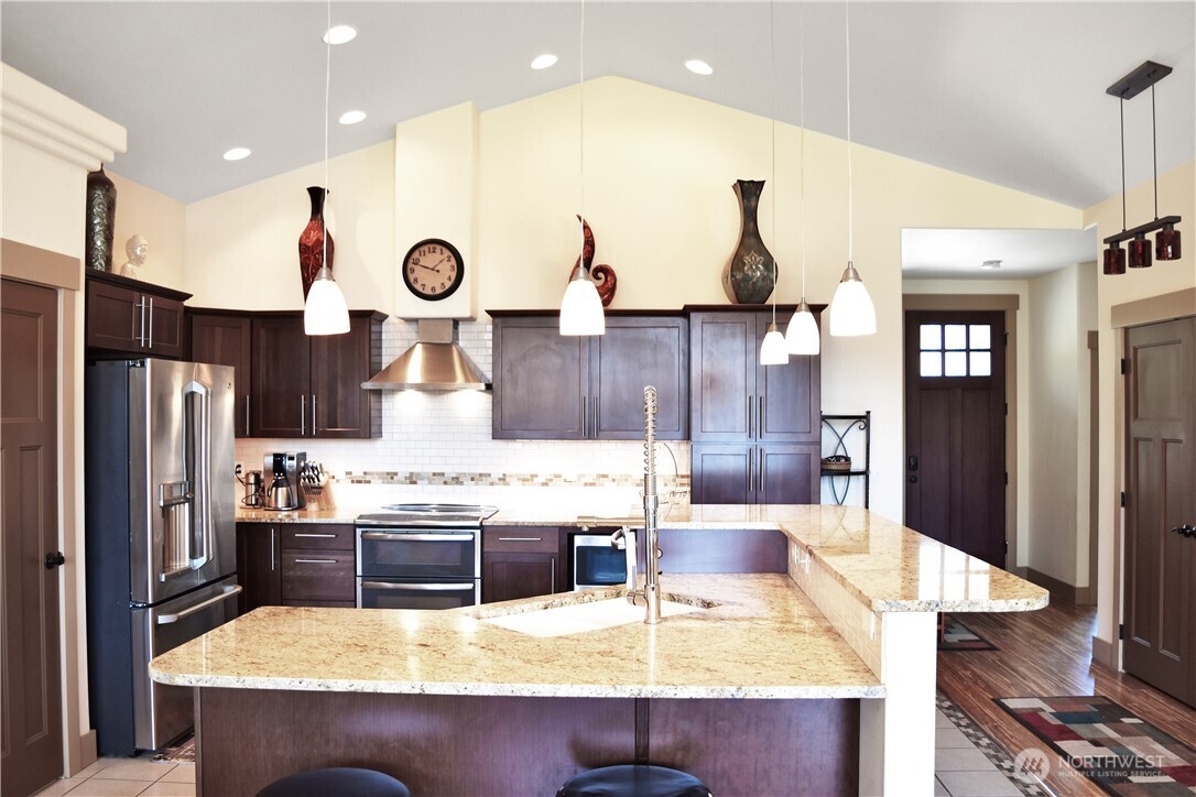 1024 Columbia Point Entiat, WA 98822 - Photo 15 of 22 a kitchen with kitchen island stainless steel appliances a sink and cabinets