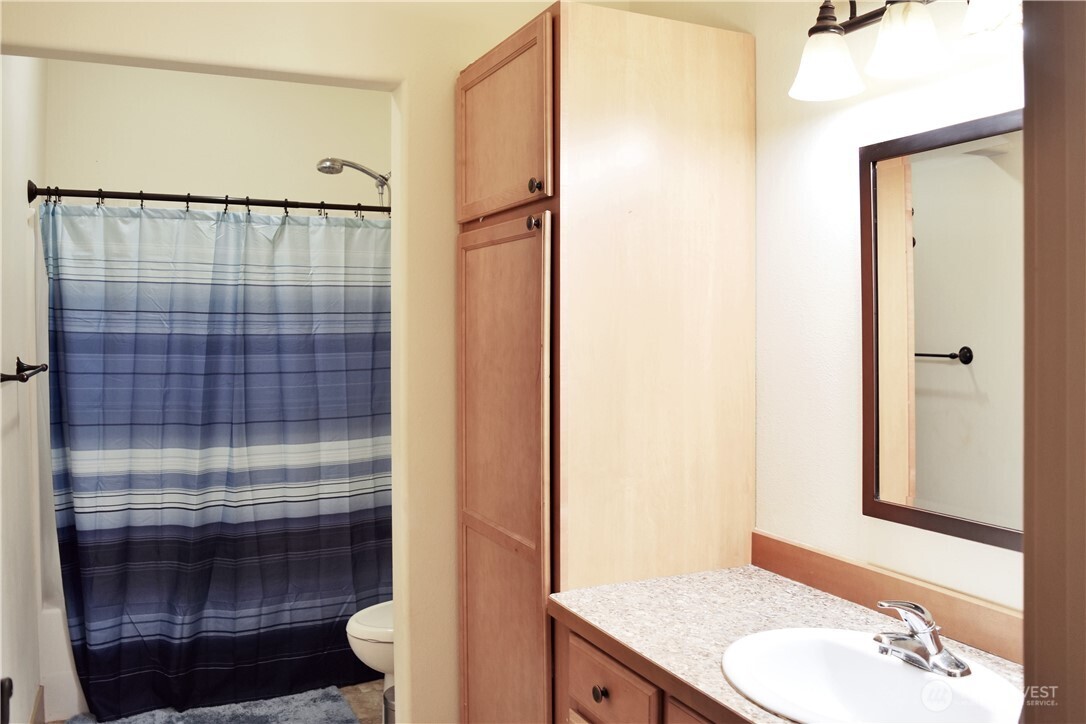 1024 Columbia Point Entiat, WA 98822 - Photo 21 of 22 a bathroom with a granite countertop shower sink and toilet