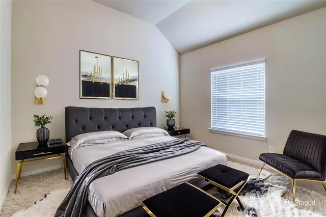 a bedroom with a bed and window