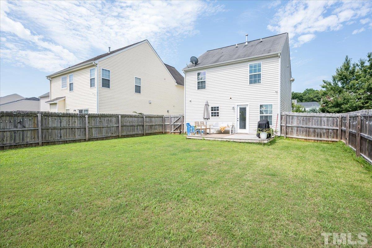 1645 Extine Lane Raleigh, NC 27610 - Photo 17 of 18 a view of a house with backyard and sitting area