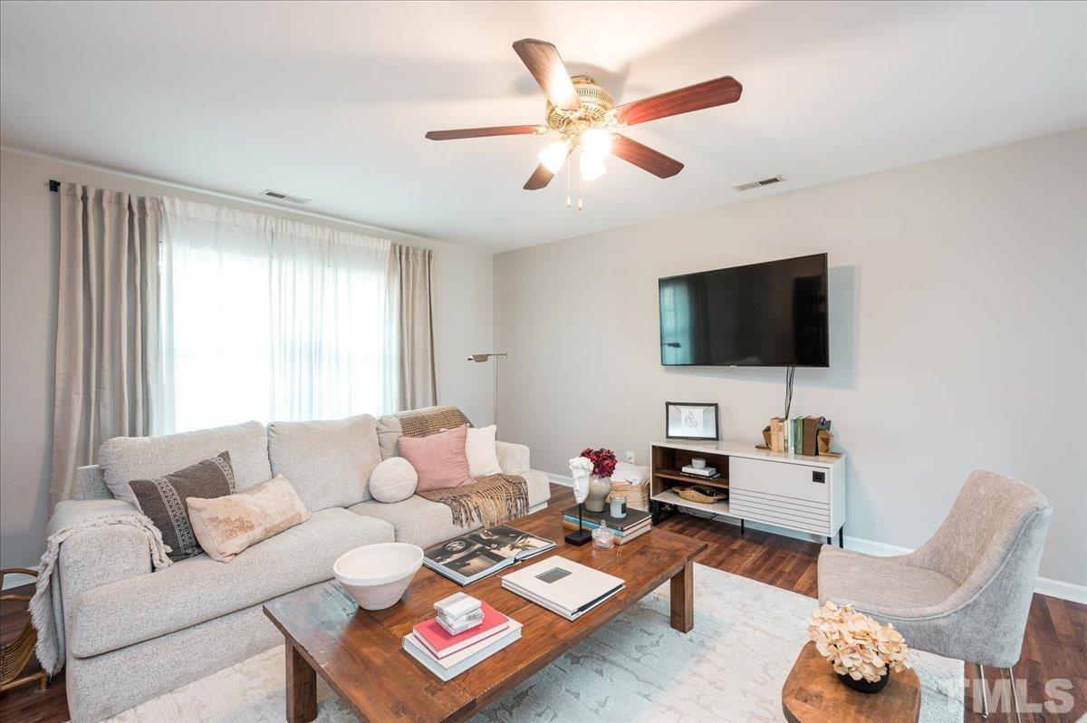 1645 Extine Lane Raleigh, NC 27610 - Photo 3 of 18 a living room with furniture and a flat screen tv