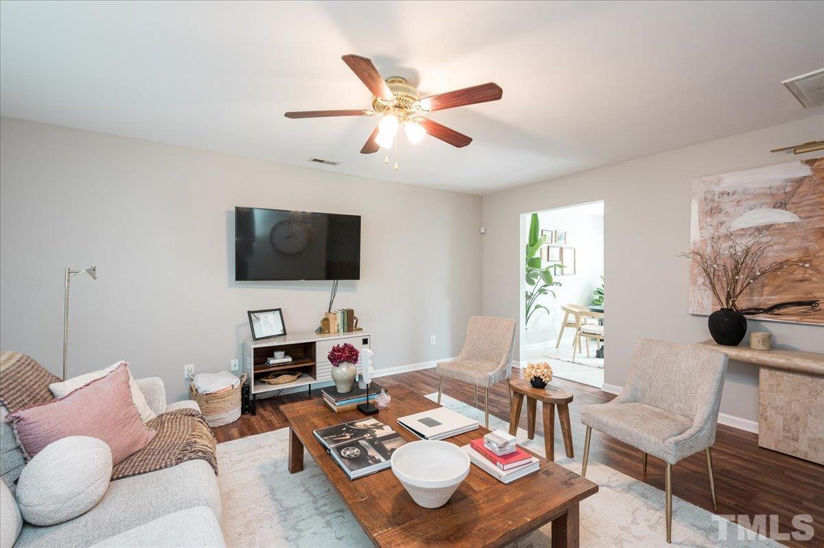1645 Extine Lane Raleigh, NC 27610 - Photo 4 of 18 a living room with furniture and a flat screen tv
