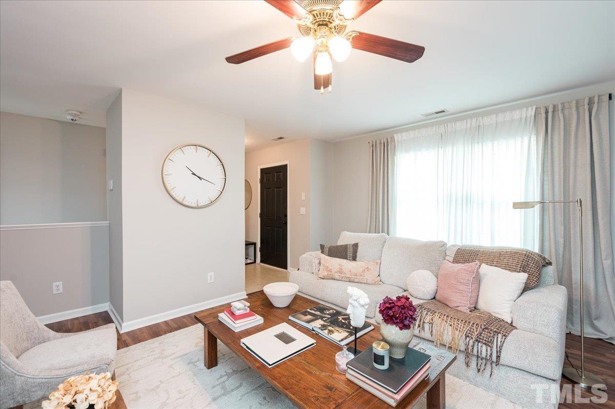 1645 Extine Lane Raleigh, NC 27610 - Photo 5 of 18 a living room with furniture and wooden floor