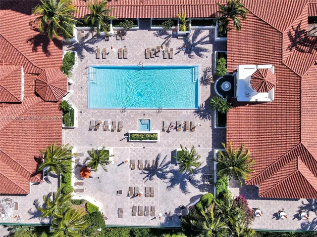 a view of a lake with a large building in the background