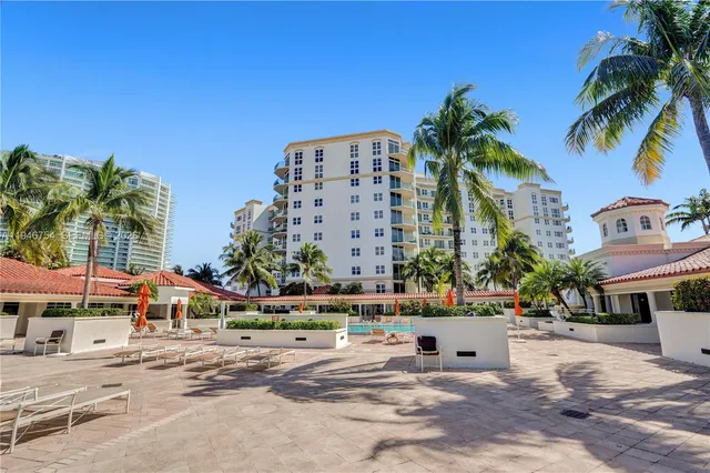 a living room with lots of furniture and clutter