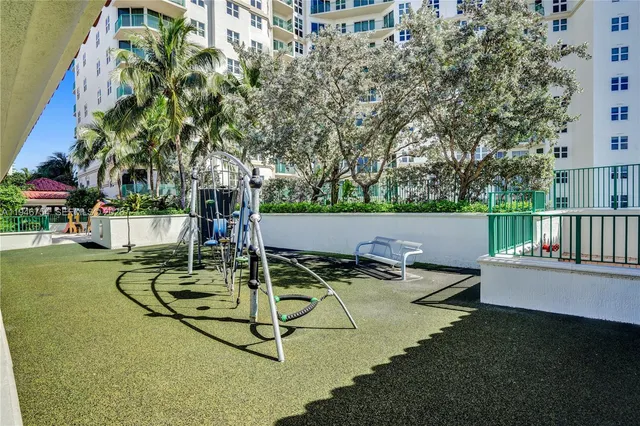 a room with pool tables and windows