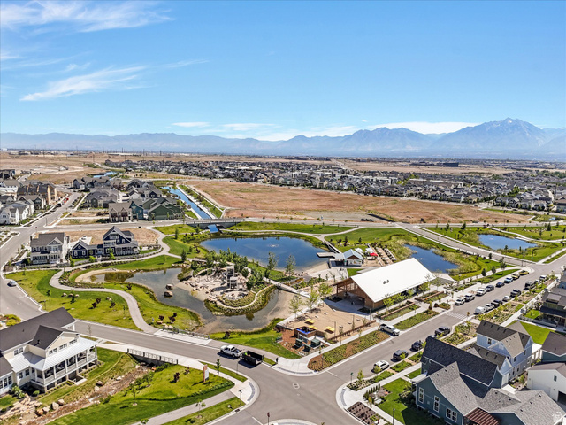 11759 South Watercourse Road South Jordan, UT 84009 - Photo 27 of 33 Community aerial featuring multiple ponds, park areas, and a community building with integrated outdoor spaces