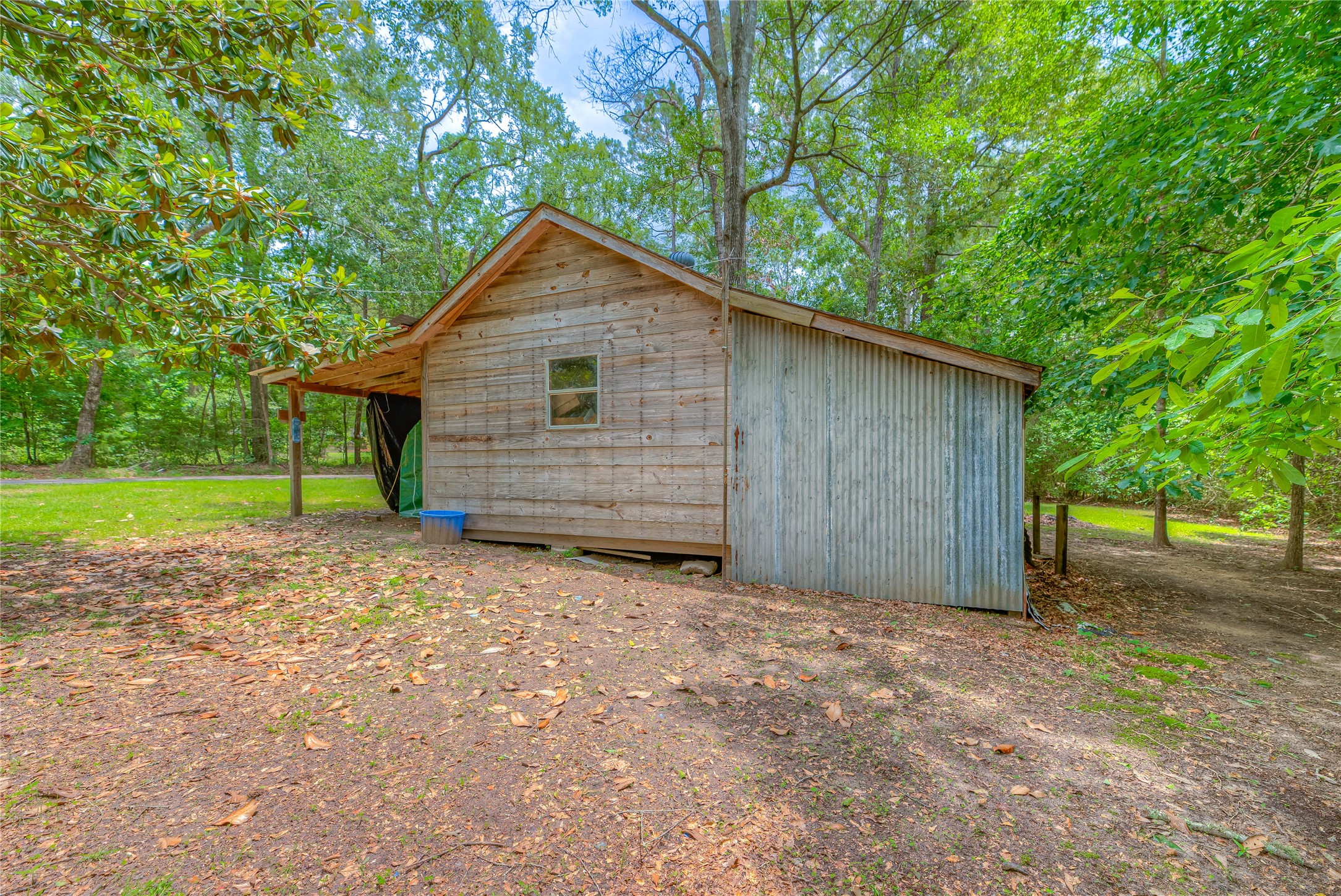 657 Parrish Road Livingston, TX 77351 - Photo 28 of 47 a view of a house with a yard