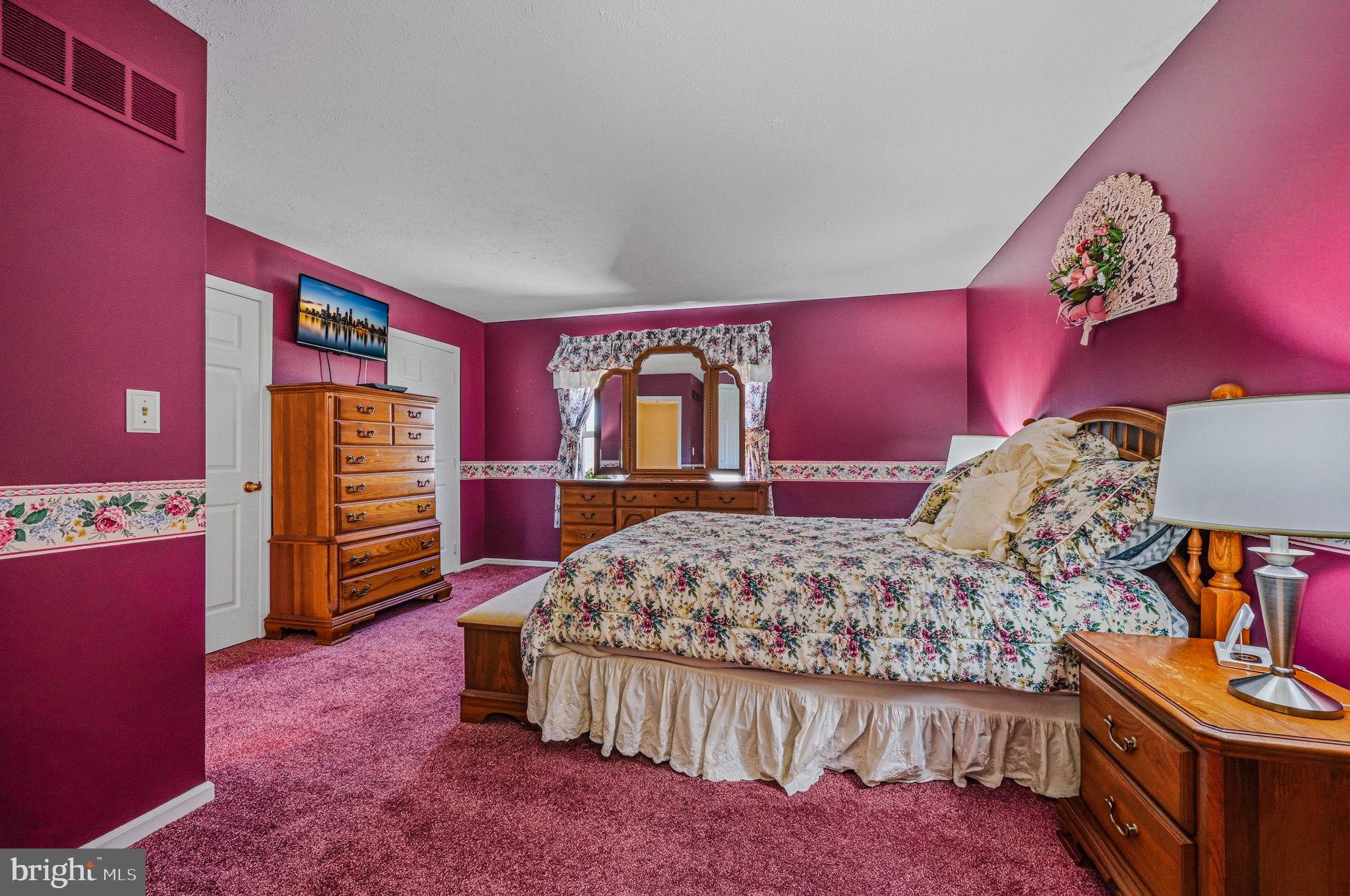 104 Balmoral Way Newark, DE 19702 - Photo 17 of 25 a bedroom with a bed and a dresser in it