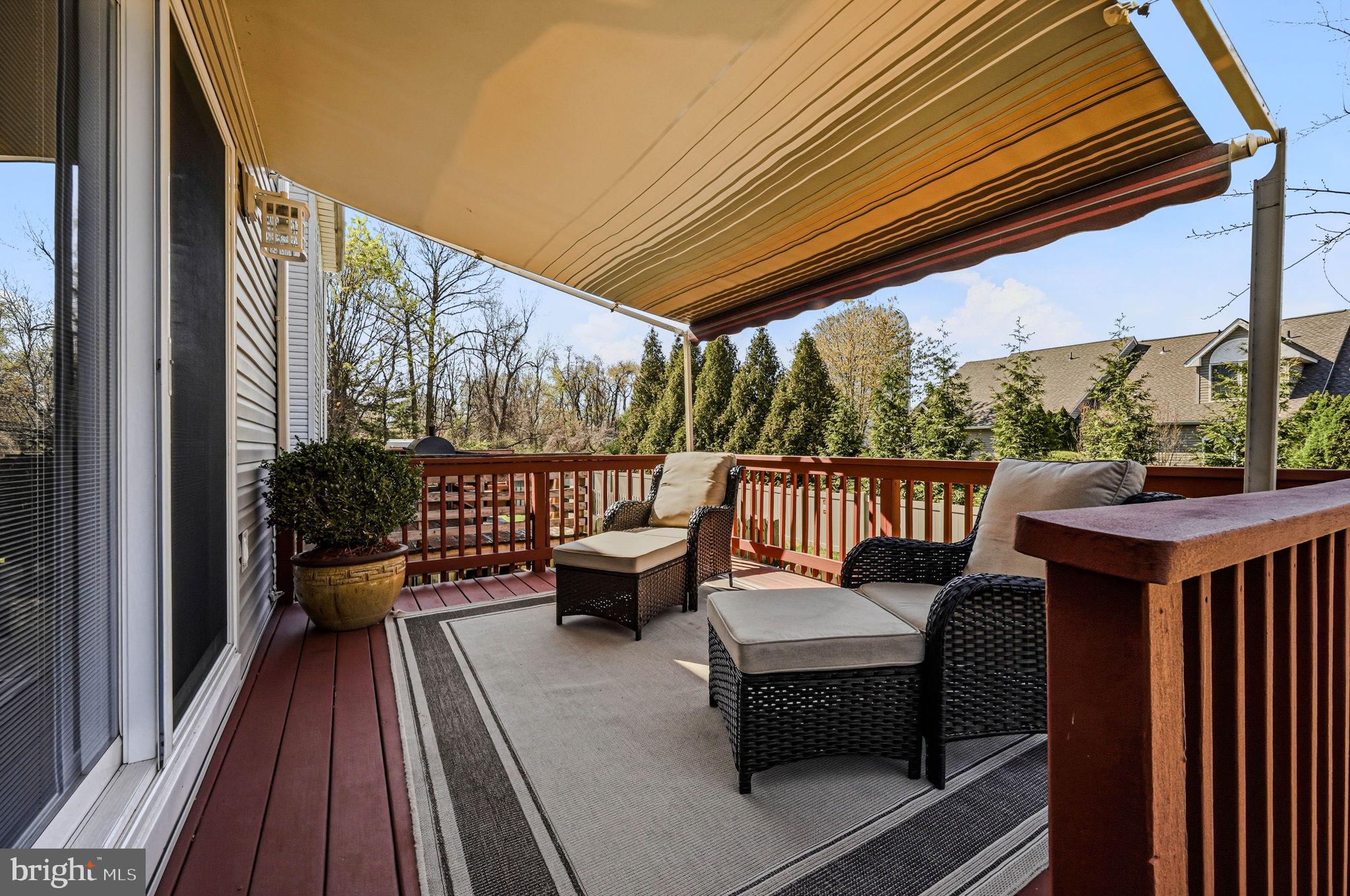 104 Balmoral Way Newark, DE 19702 - Photo 23 of 25 a balcony with wooden floor and outdoor seating