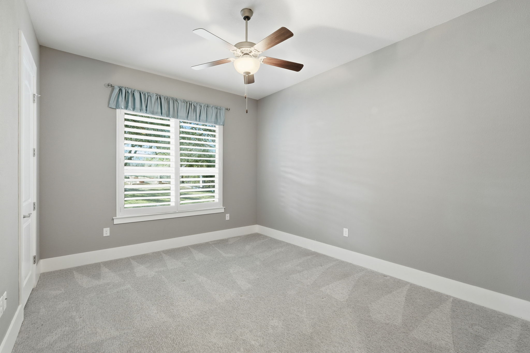 403 Highland Spring Lane Georgetown, TX 78633 - Photo 27 of 40 Unfurnished room featuring light carpet and ceiling fan
