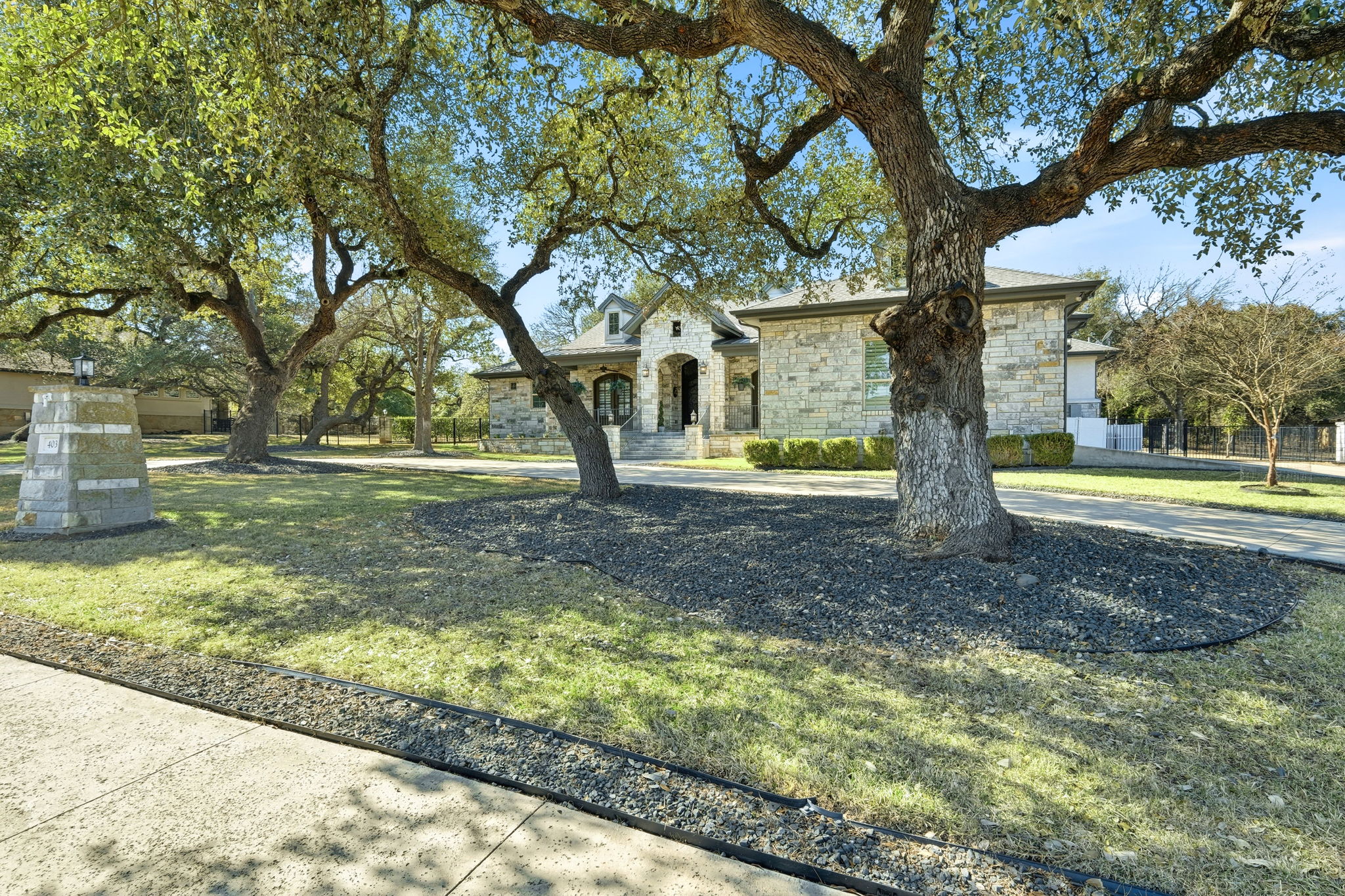 403 Highland Spring Lane Georgetown, TX 78633 - Photo 5 of 40 French country home featuring stone siding and a front yard