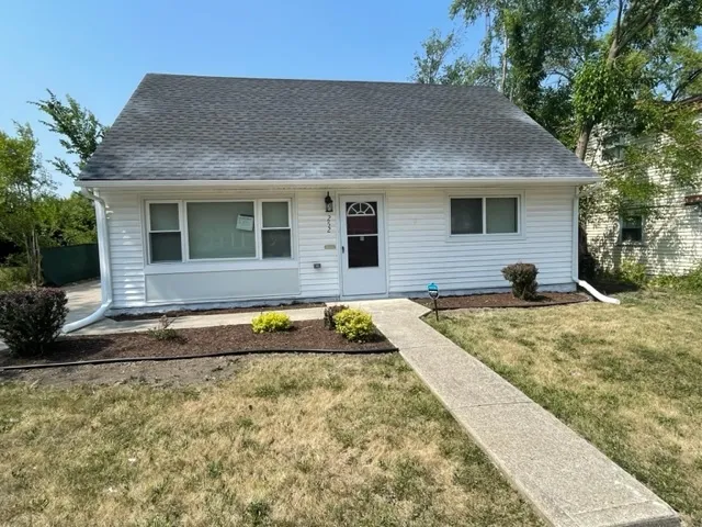 a view of a house with swimming pool and sitting area