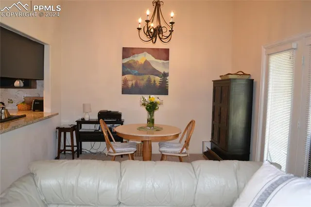 a view of a livingroom with furniture and a flat screen tv