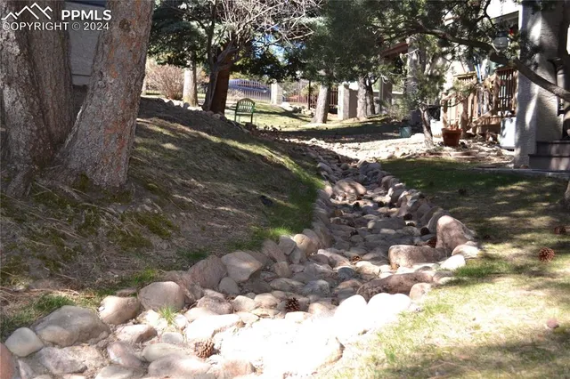 a view of a backyard with chairs