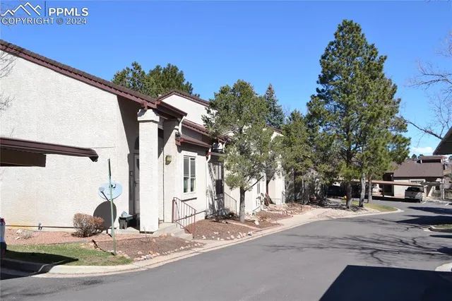a view of street with a building in the background