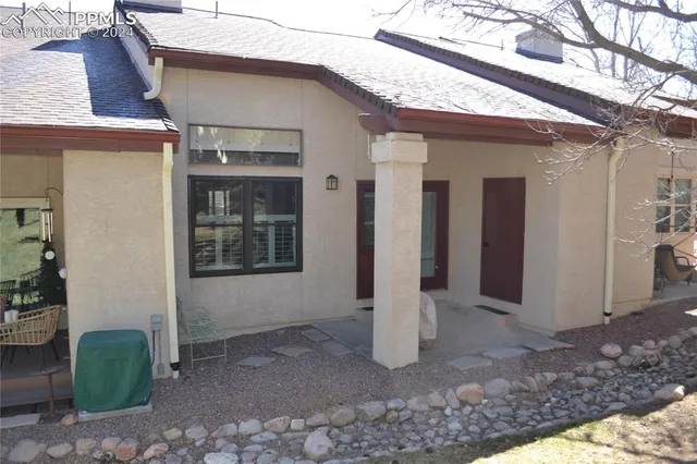 a view of a backyard of the house