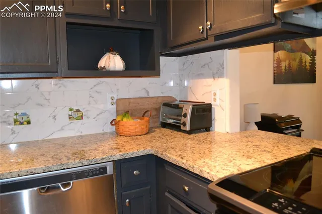 a kitchen with a stove and a microwave