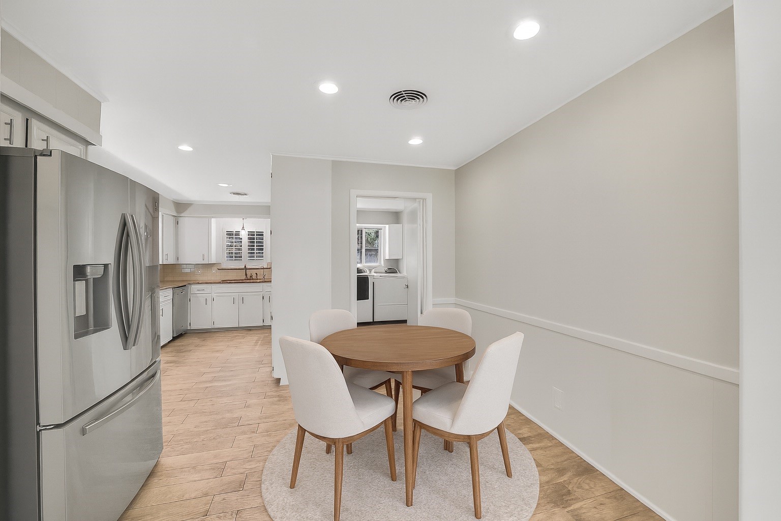10135 Knoboak Drive Houston, TX 77080 - Photo 13 of 26 Breakfast area conveniently located in the kitchen, with the utility room to the upper right. This versatile zone serves as a natural connection point for everyday dining and household routines. Note: this image has been virtually staged.