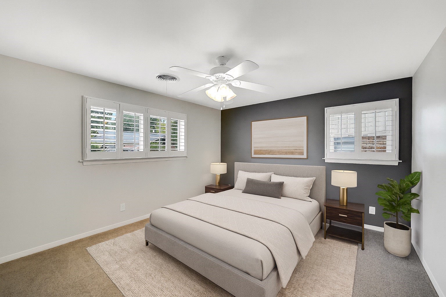10135 Knoboak Drive Houston, TX 77080 - Photo 17 of 26 View of secondary bedroom #1 from the doorway shows its generous size and natural light. Windows with plantation shutters—two overlooking the front yard and one to the side—create a bright yet private setting. A walk-in closet with built-in shelving offers excellent storage and organization. Note: this image has been virtually staged.