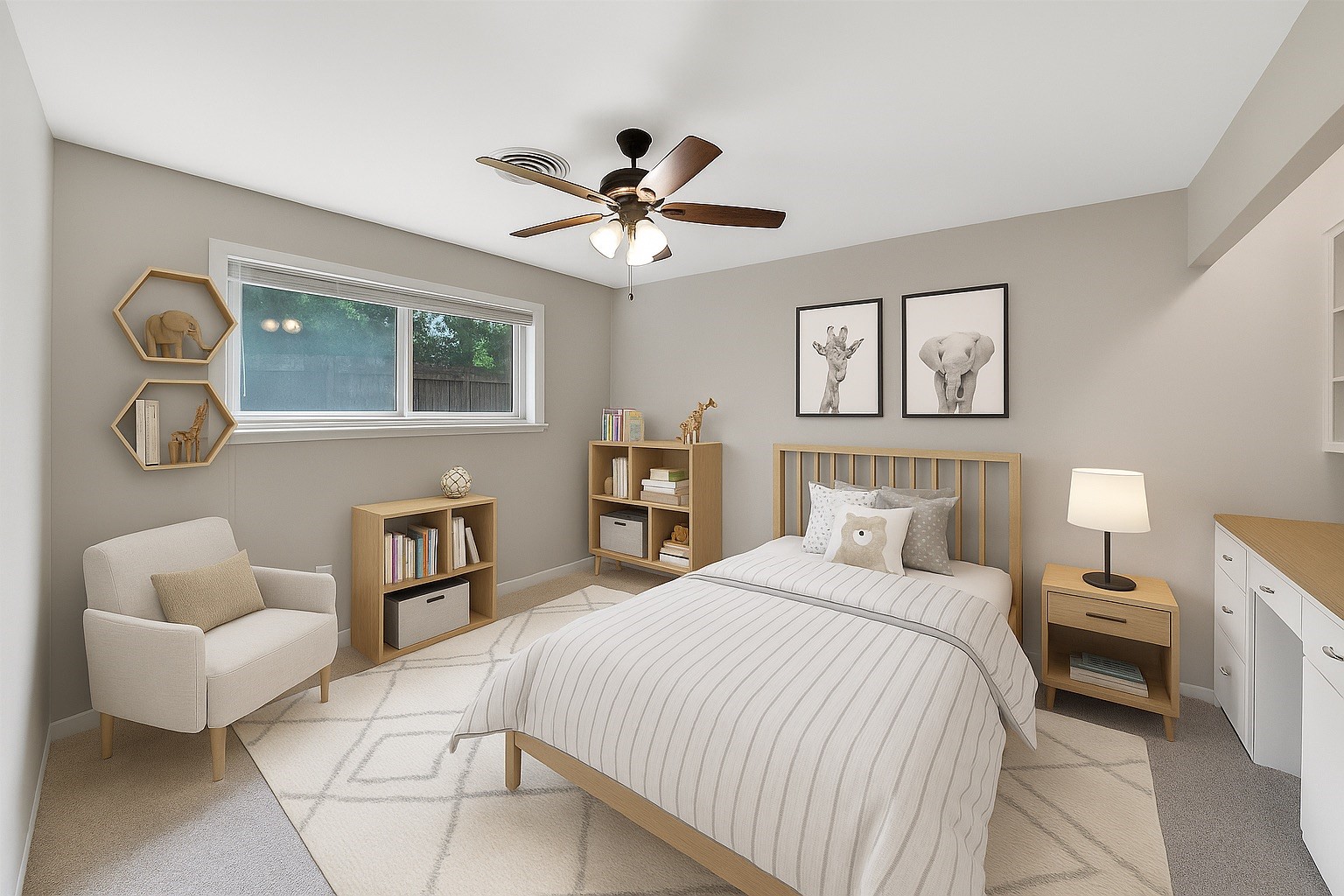 10135 Knoboak Drive Houston, TX 77080 - Photo 19 of 26 Spacious secondary bedroom #2 with windows overlooking the backyard, all dressed in plantation shutters for light control and privacy. A ceiling fan with light adds comfort, while the room’s generous size provides flexibility for furnishings and layout. To the right is a built-in desk.