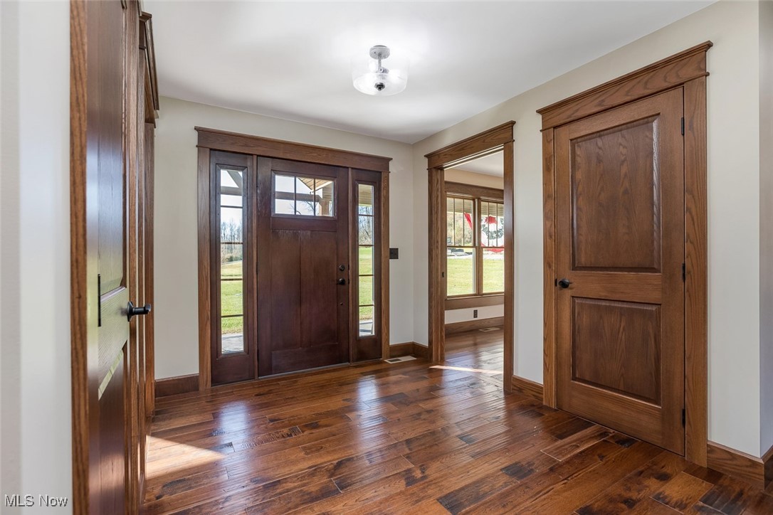 9615 Rural Dale Road Blue Rock, OH 43720 - Photo 8 of 50 Foyer entrance featuring dark wood-style floors and baseboards