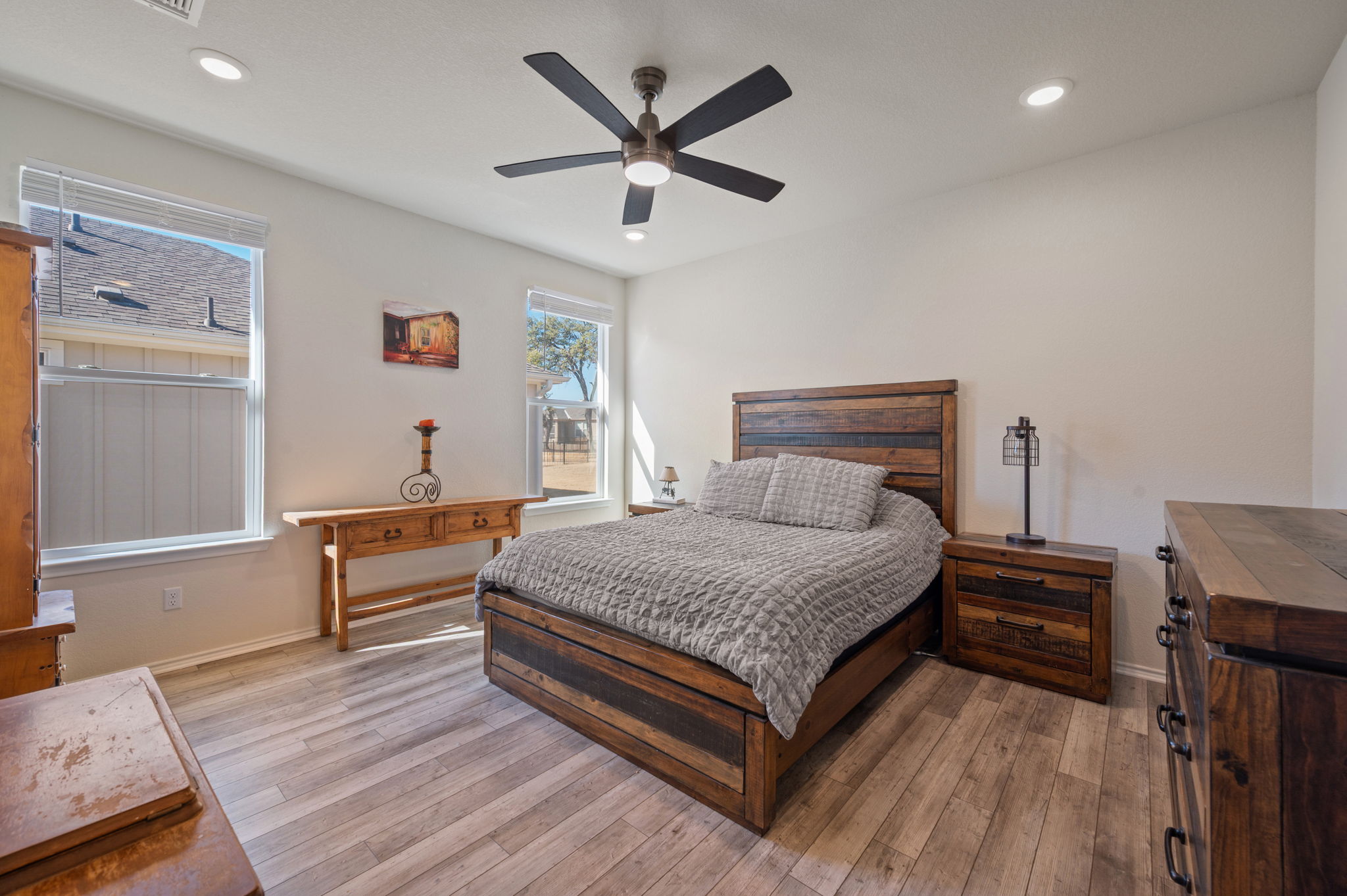 100 Bristol Cove Georgetown, TX 78633 - Photo 13 of 31 a bedroom with a bed and wooden floor