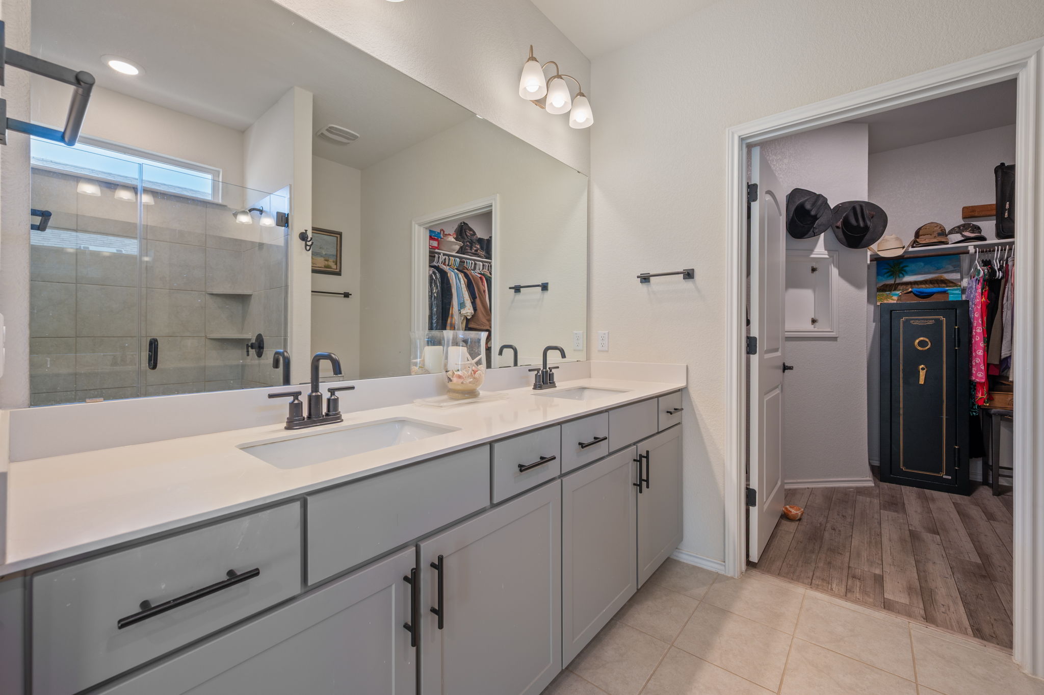 100 Bristol Cove Georgetown, TX 78633 - Photo 15 of 31 a bathroom with a double vanity sink a mirror and shower