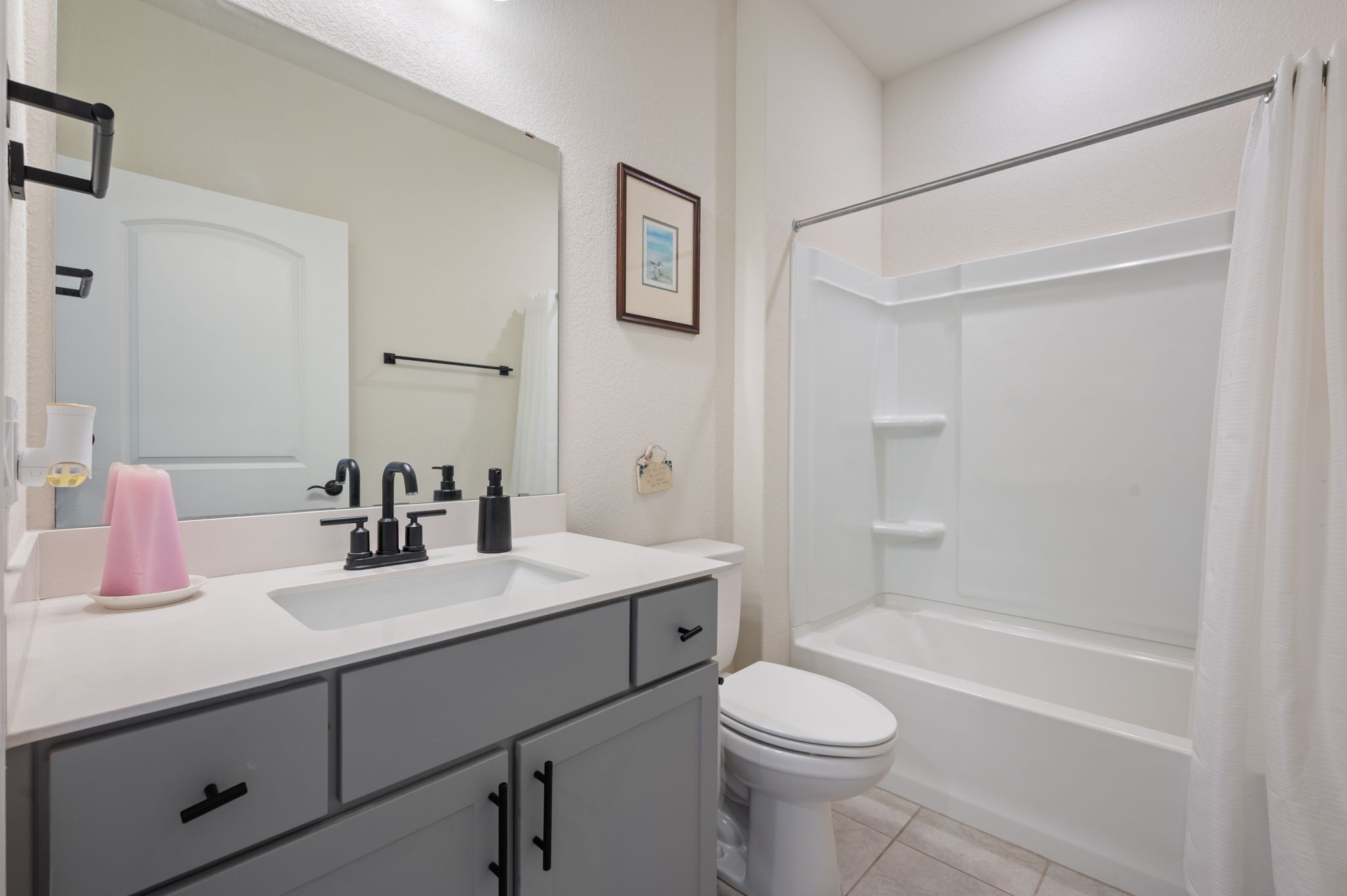 100 Bristol Cove Georgetown, TX 78633 - Photo 19 of 31 a bathroom with a sink a toilet and shower