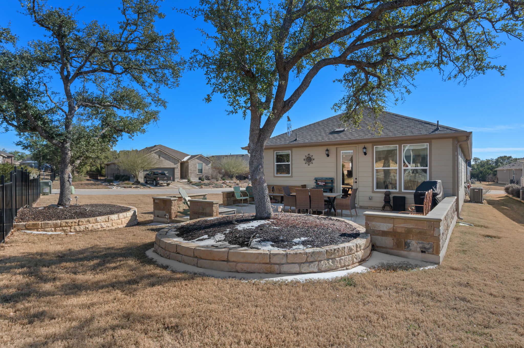 100 Bristol Cove Georgetown, TX 78633 - Photo 23 of 31 a view of a house with backyard and sitting area