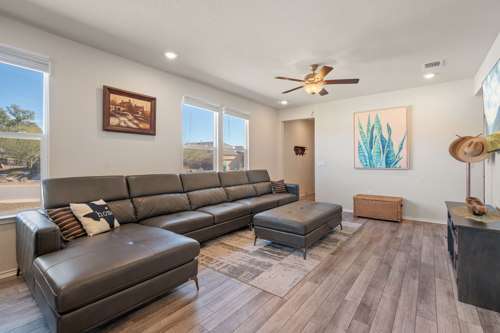 100 Bristol Cove Georgetown, TX 78633 - Photo 4 of 31 a living room with furniture and a ceiling fan