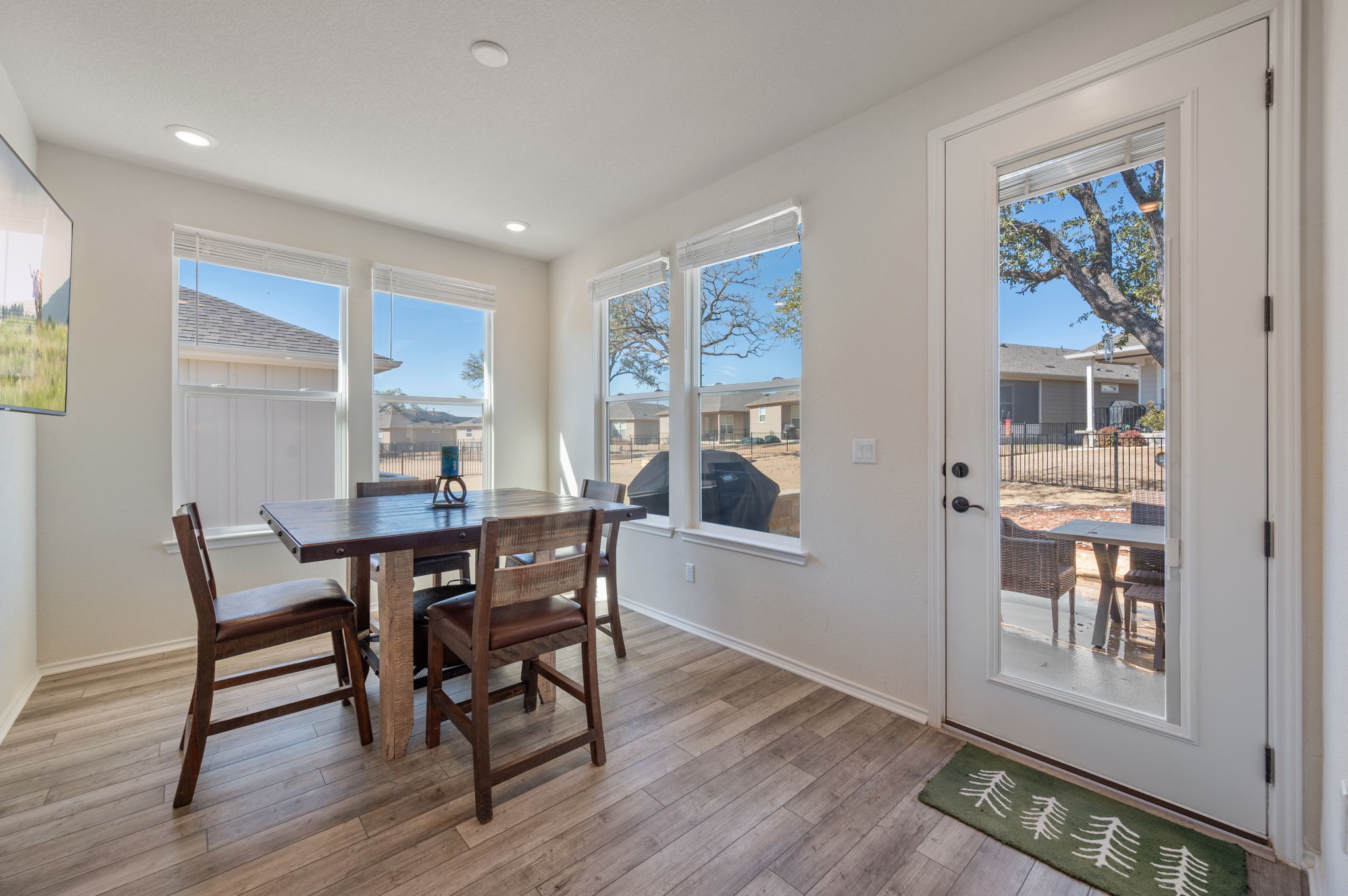 100 Bristol Cove Georgetown, TX 78633 - Photo 10 of 31 a view of a dining room with furniture and wooden floor