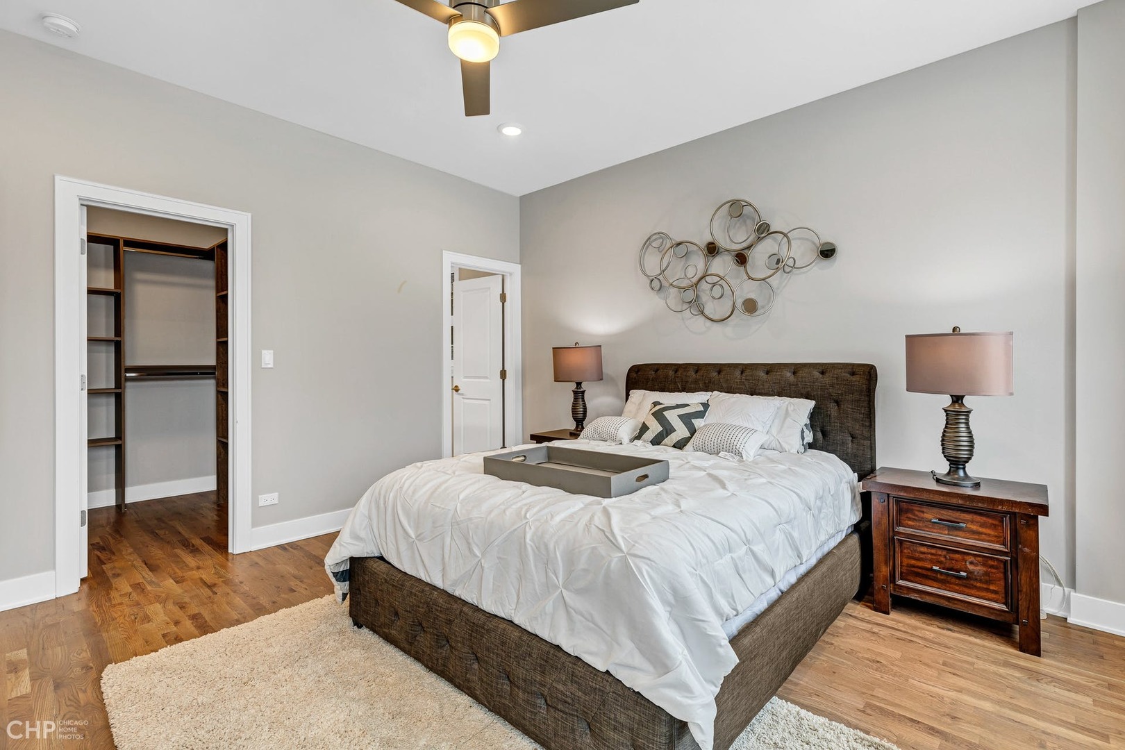 4101 South Drexel Boulevard, Unit 101 Chicago, IL 60653 - Photo 11 of 19 a bedroom with a bed and wooden floor