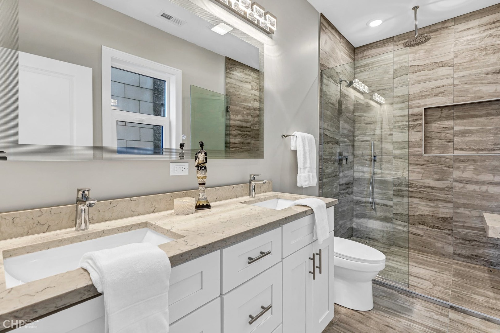 4101 South Drexel Boulevard, Unit 101 Chicago, IL 60653 - Photo 13 of 19 a bathroom with a sink a toilet and shower