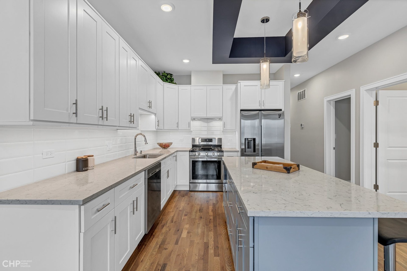 4101 South Drexel Boulevard, Unit 101 Chicago, IL 60653 - Photo 4 of 19 a kitchen with stainless steel appliances granite countertop a sink stove and refrigerator