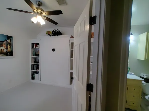 a bathroom with a sink a toilet and shower curtain