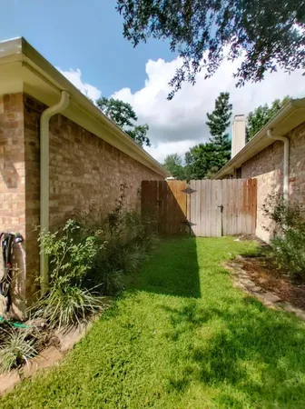 a backyard of a house with lots of green space