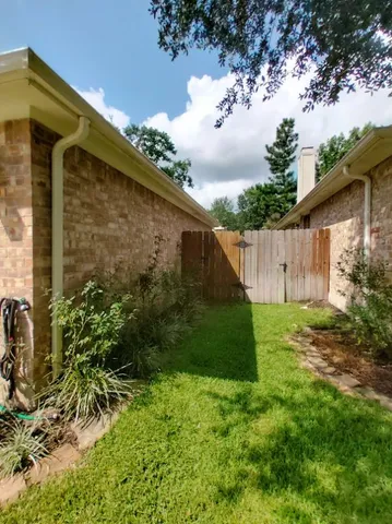 a backyard of a house with lots of green space