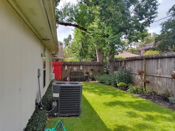 a view of a garden filled with lots of potted plants