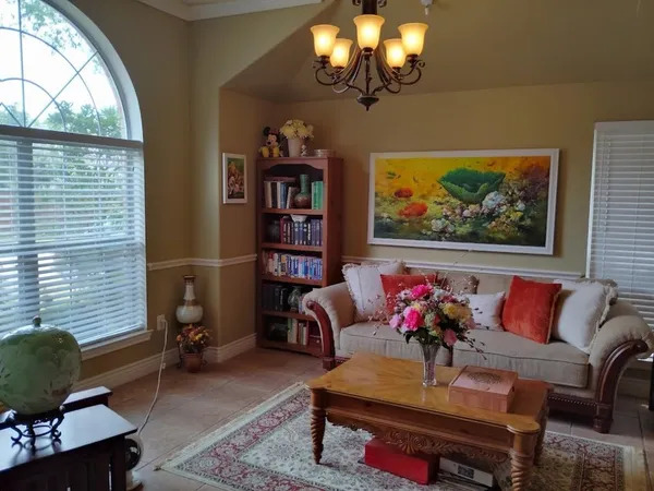 a living room with furniture and a window