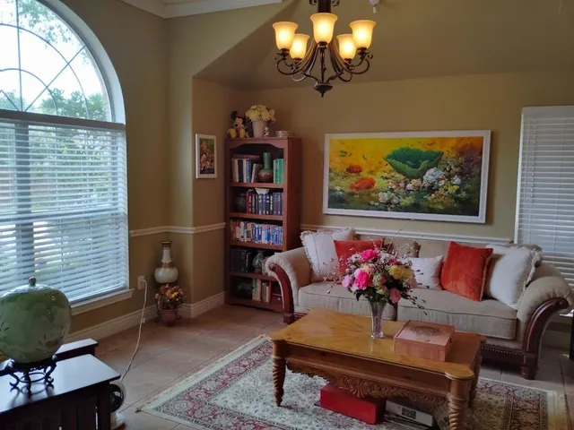 a living room with furniture and a window