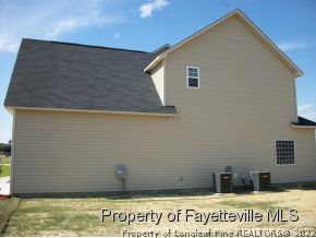 633 Pecan Grove Loop Hope Mills, NC 28348 - Photo 4 of 6 a view of a wooden door