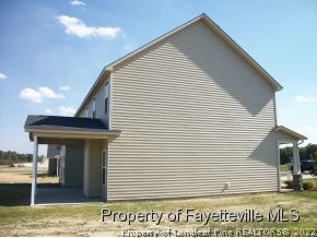 633 Pecan Grove Loop Hope Mills, NC 28348 - Photo 6 of 6 a view of a house with a balcony