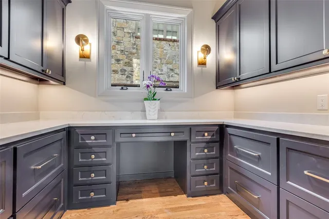 a living room with furniture a rug and a chandelier