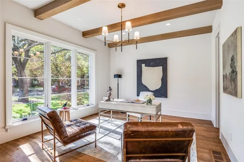 a living room with furniture a window and a table