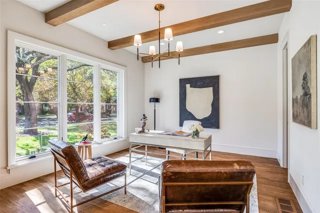 a living room with furniture a window and a table