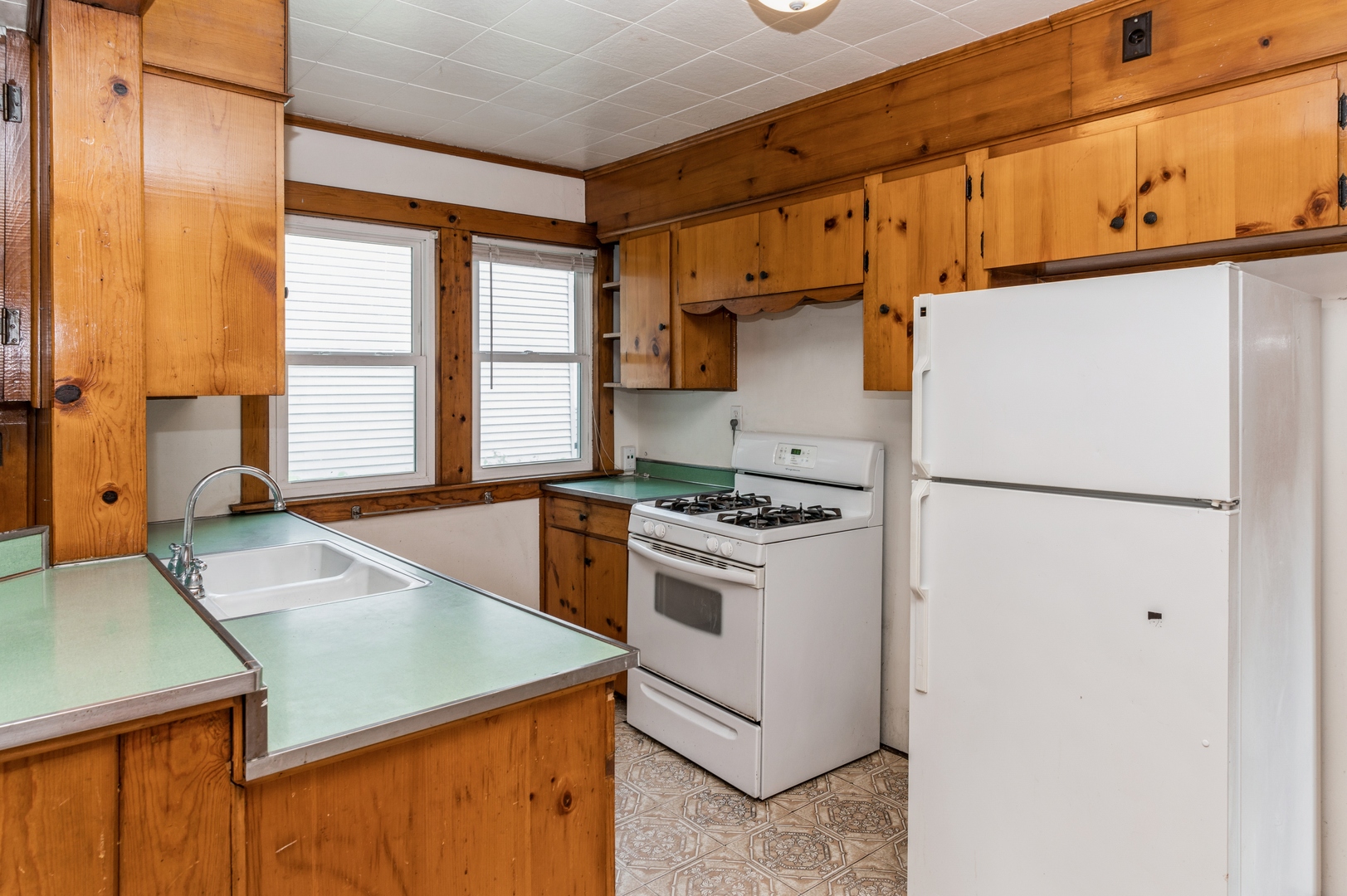 1350 Ridge Road Homewood, IL 60430 - Photo 4 of 10 a kitchen with a refrigerator a stove a sink and a cabinets