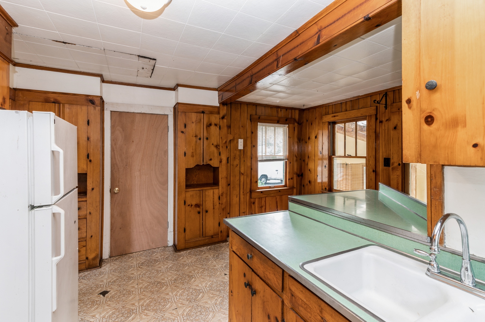 1350 Ridge Road Homewood, IL 60430 - Photo 5 of 10 a kitchen with stainless steel appliances granite countertop a refrigerator and a sink
